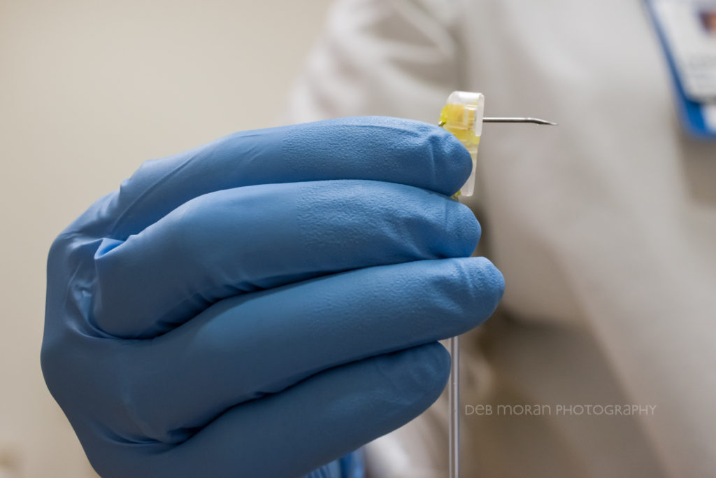 Anyway, that is the needle that goes into my port. That is the hand all covered in blue that's holding the needle that goes into my port. That is Arlene, oncology nurse, whose hand all covered in blue is holding needle that goes into my port. I won’t go on, but I could.